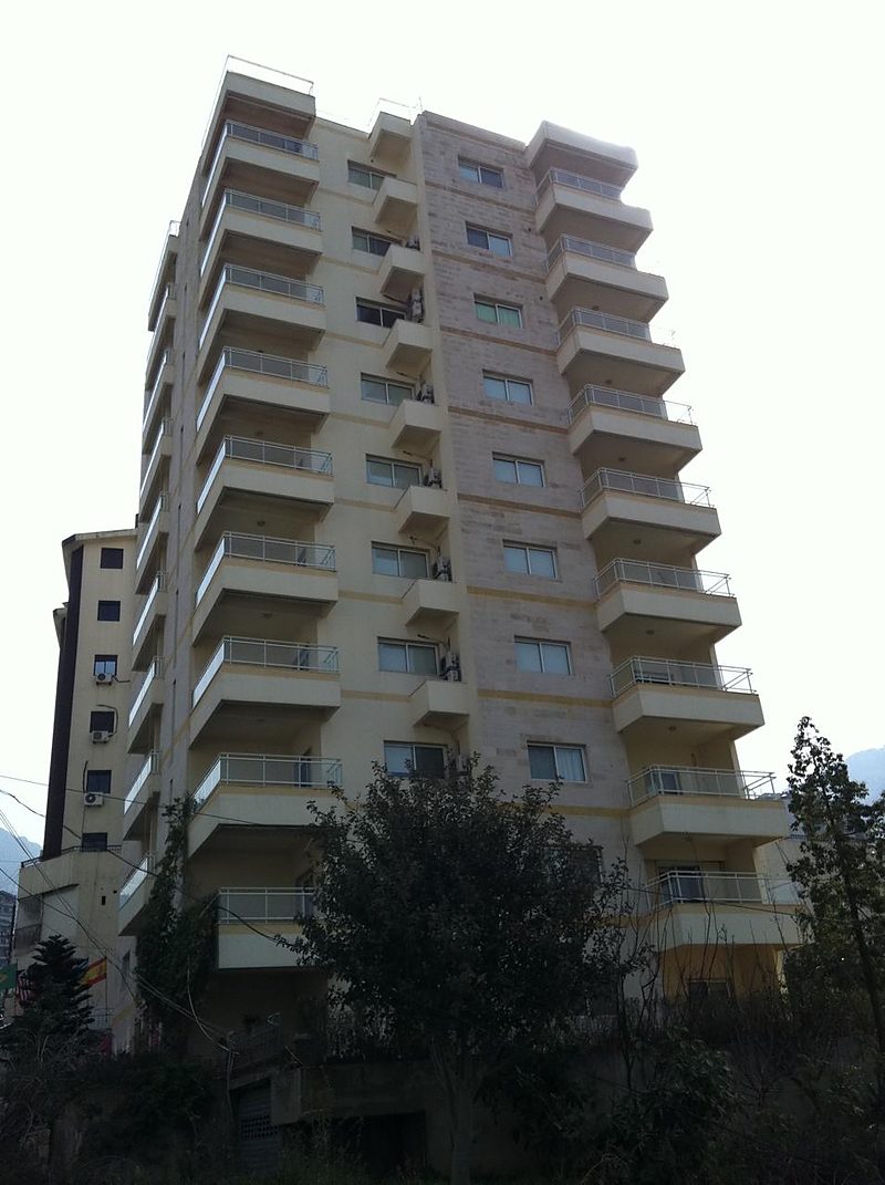 The Leone Residence tower in Sahel Alma, its balconies stepping down the hillside above Jounieh bay